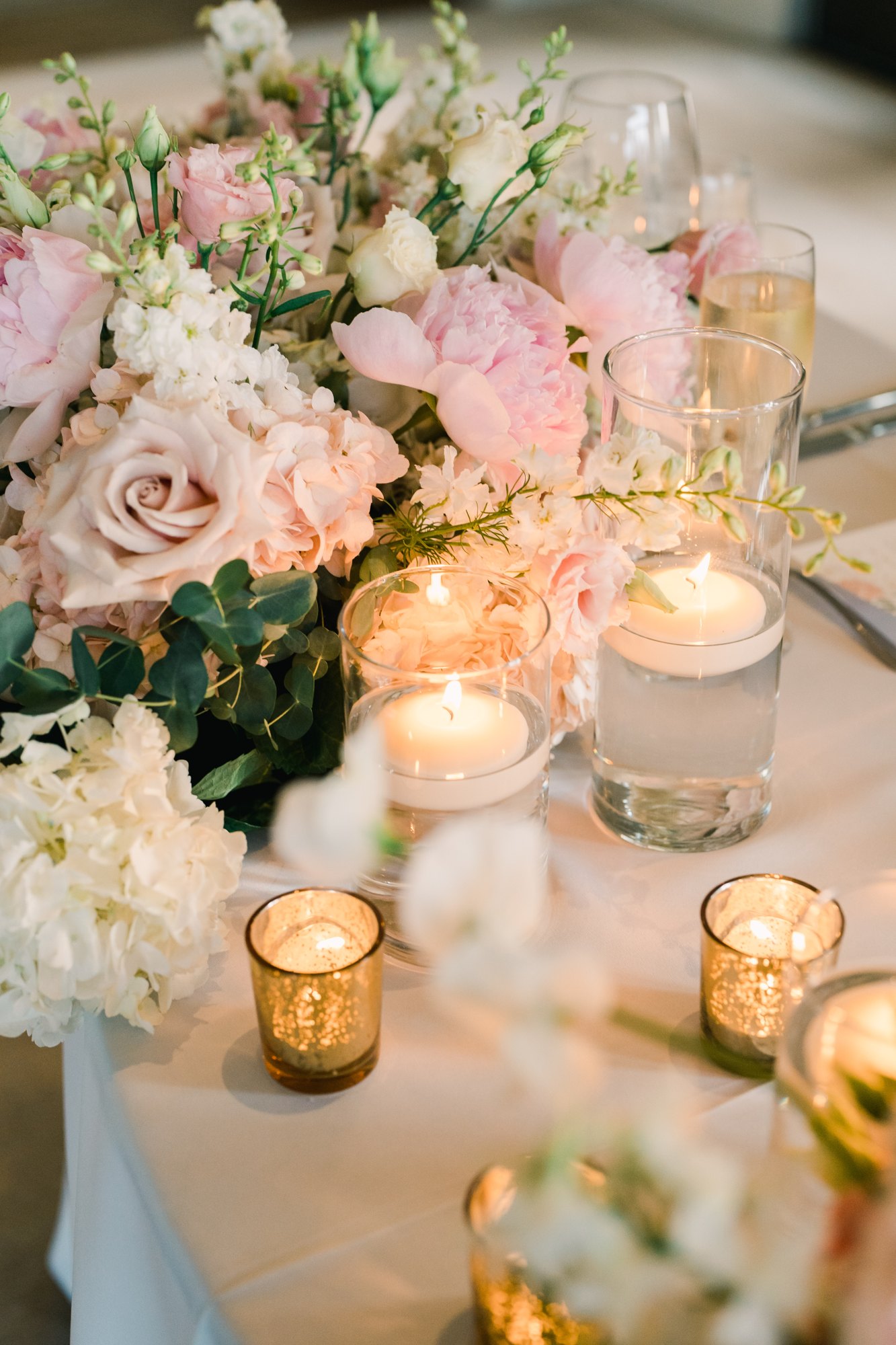 Peach and blush low centerpiece with candlelight
